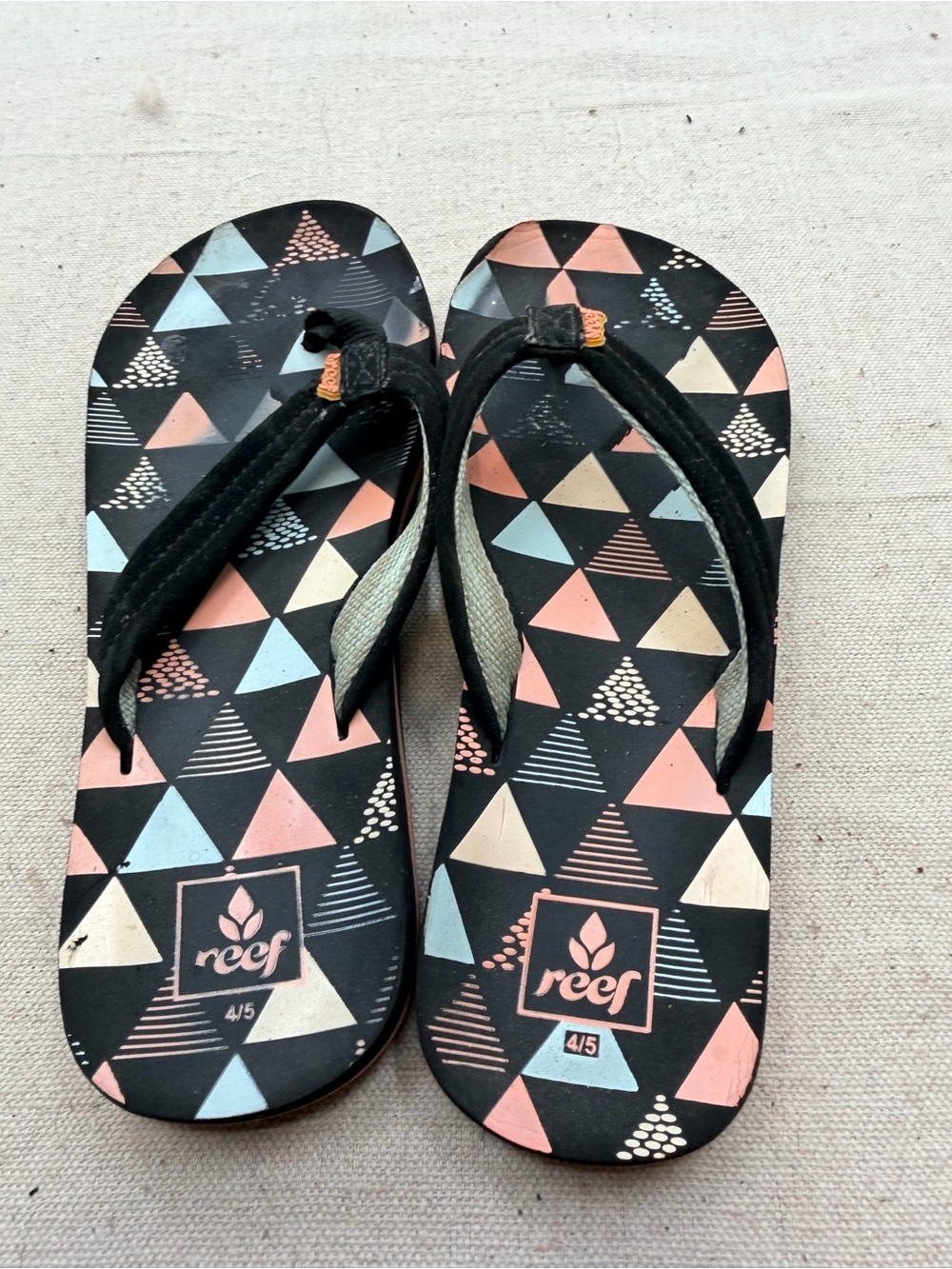 Reef Black Flip Flops with Coral & Light Blue Triangle Print
